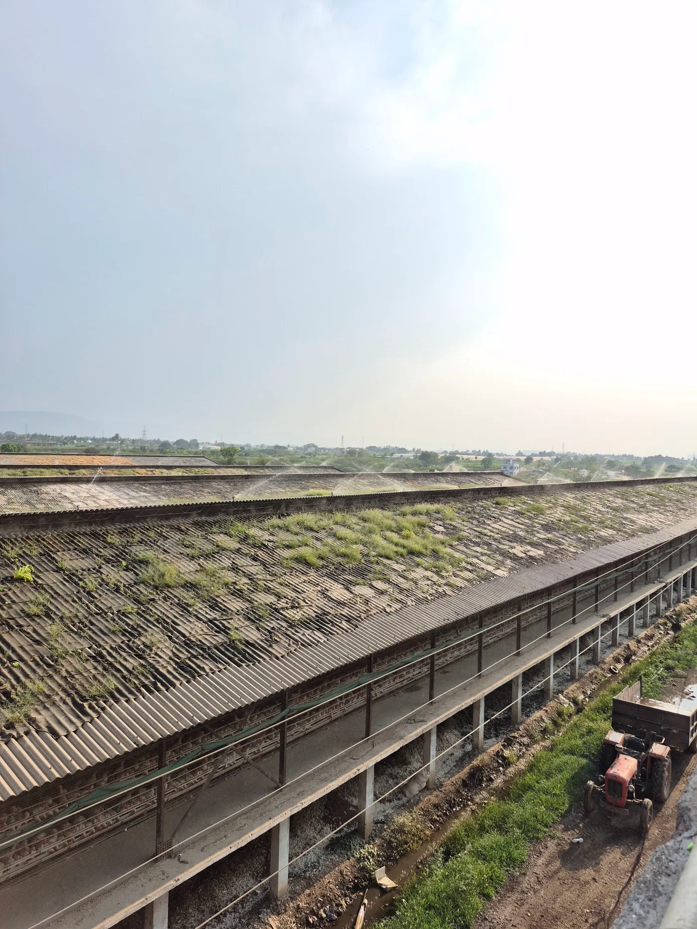 Elevated roofline view with tractor and service area below
